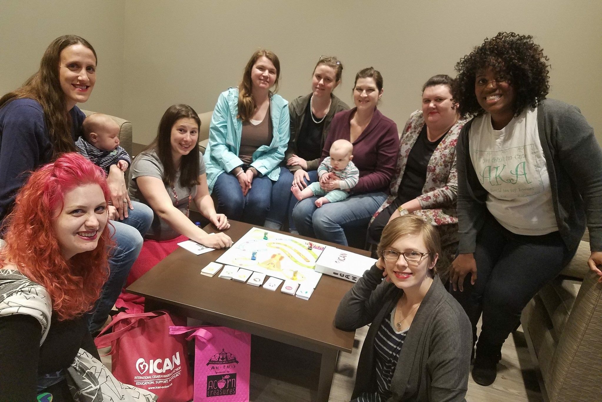 ICAN support group gathered around table with board game